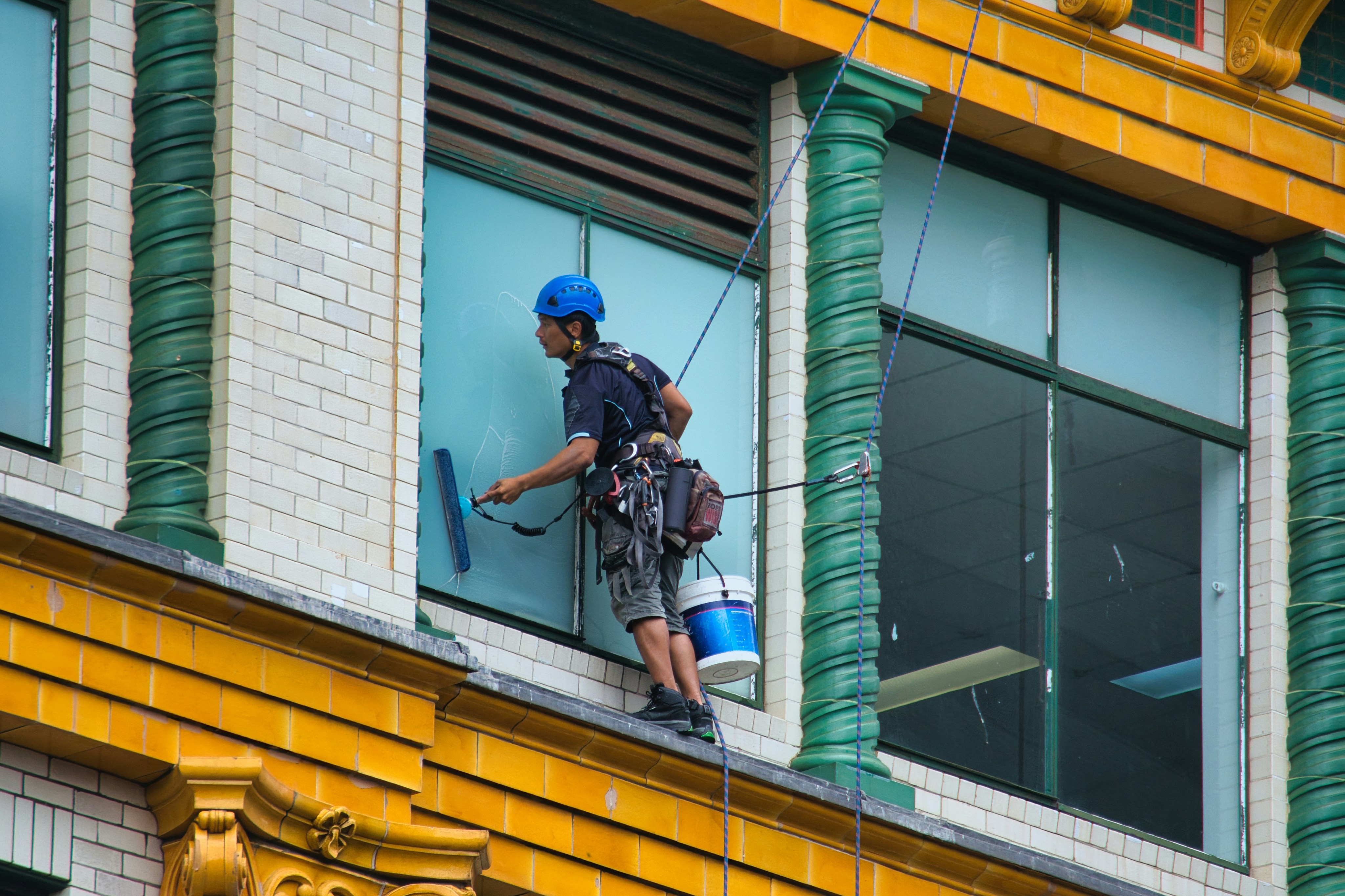 Window washer cleaning a commercial building facade