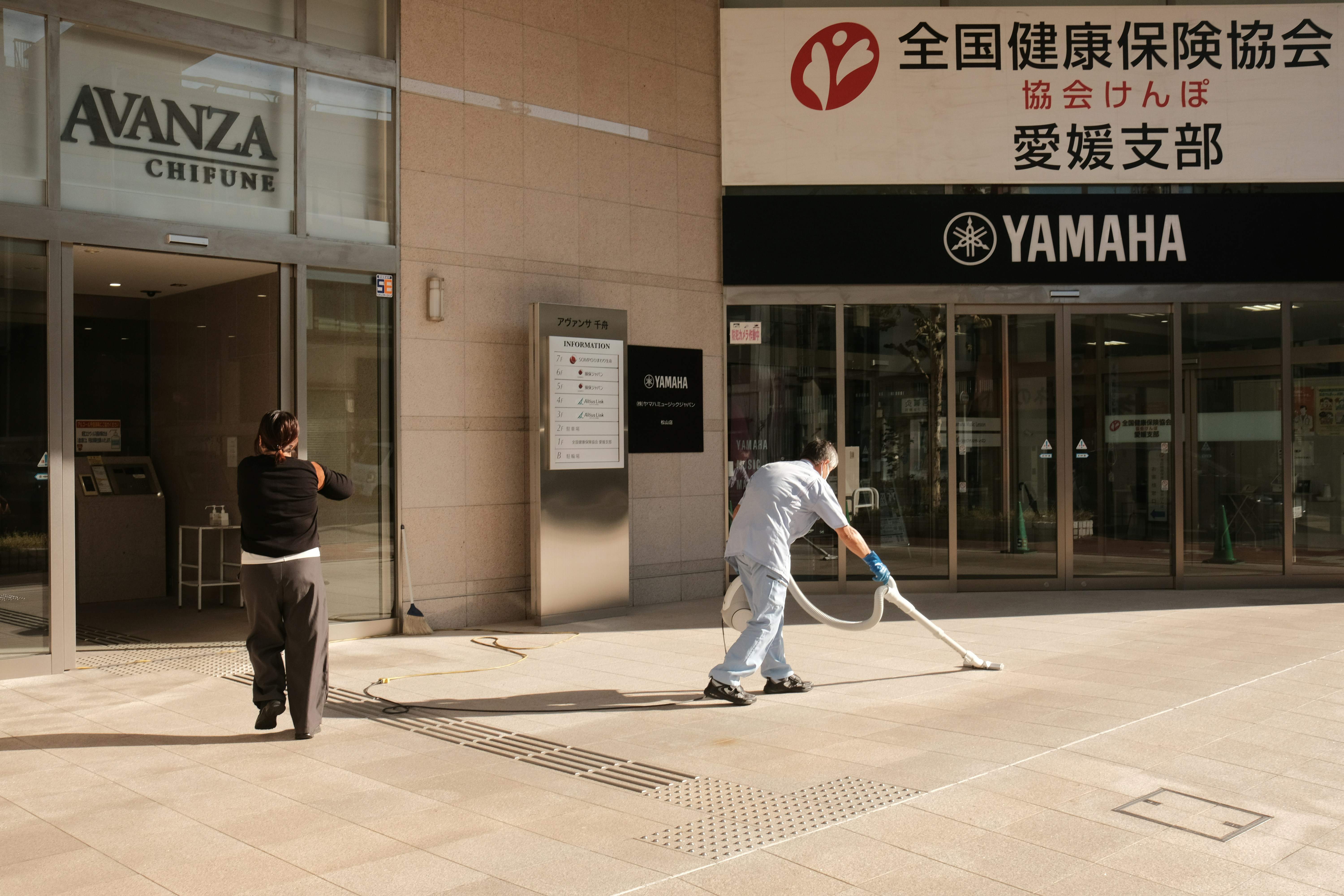 Window washing crew on a high-rise glass tower